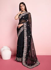Embroidered black colour saree